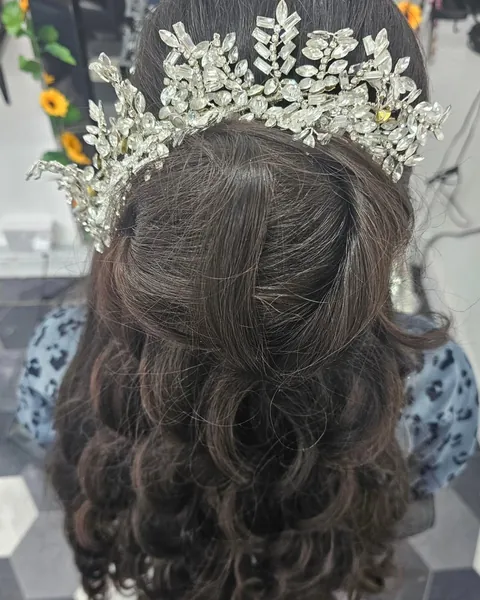 Occasion style with voluminous curls and a crystal headpiece